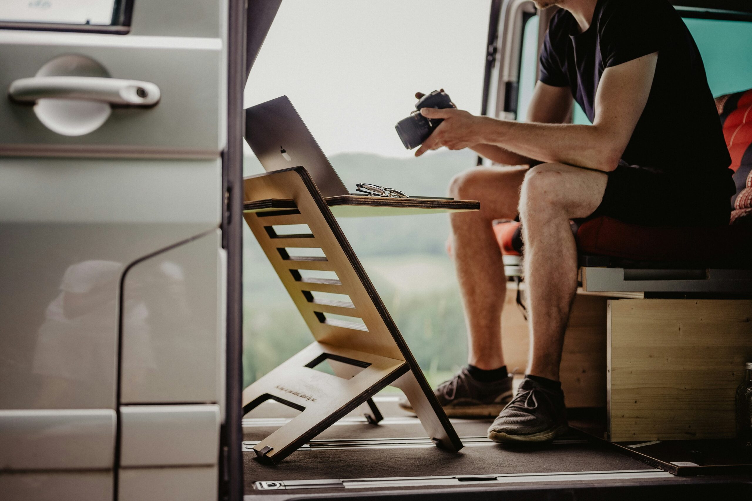 a man sitting in the back of a van